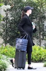 Pregnant KARLIE KLOSS Arrives at Miami International Airport 05/16/2023