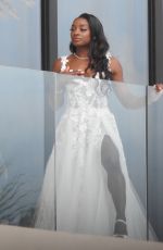 SIMONE BILES on Her Balcony Getting Ready for Ties the Knot with Jonathan Owens in Cabo San Lucas 05/06/2023 