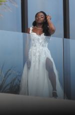 SIMONE BILES on Her Balcony Getting Ready for Ties the Knot with Jonathan Owens in Cabo San Lucas 05/06/2023 