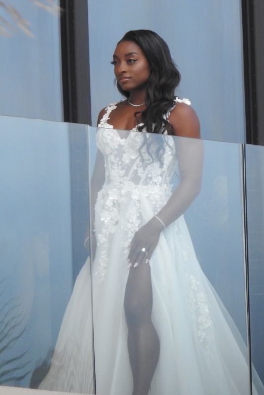SIMONE BILES on Her Balcony Getting Ready for Ties the Knot with Jonathan Owens in Cabo San Lucas 05/06/2023