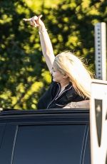 ALABAMA BARKER Standing Out of Sunroof of Her Cadillac Escalade SUV in Calabasas 06/26/2023