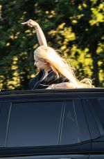 ALABAMA BARKER Standing Out of Sunroof of Her Cadillac Escalade SUV in Calabasas 06/26/2023