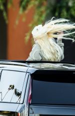 ALABAMA BARKER Standing Out of Sunroof of Her Cadillac Escalade SUV in Calabasas 06/26/2023