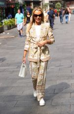 AMANDA HOLDEN Out at a Taxi Bike in London 06/27/2023