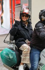 AMANDA HOLDEN Out at a Taxi Bike in London 06/27/2023