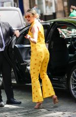 ASHLEY ROBERTS in a Bright Yellow Trousers and Waistcoat Leaves Heart Breakfast Show in London 06/21/2023