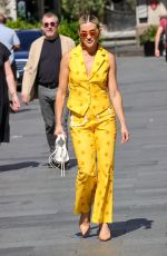 ASHLEY ROBERTS in a Bright Yellow Trousers and Waistcoat Leaves Heart Breakfast Show in London 06/21/2023