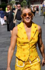 ASHLEY ROBERTS in a Bright Yellow Trousers and Waistcoat Leaves Heart Breakfast Show in London 06/21/2023