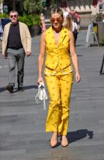 ASHLEY ROBERTS in a Bright Yellow Trousers and Waistcoat Leaves Heart Breakfast Show in London 06/21/2023