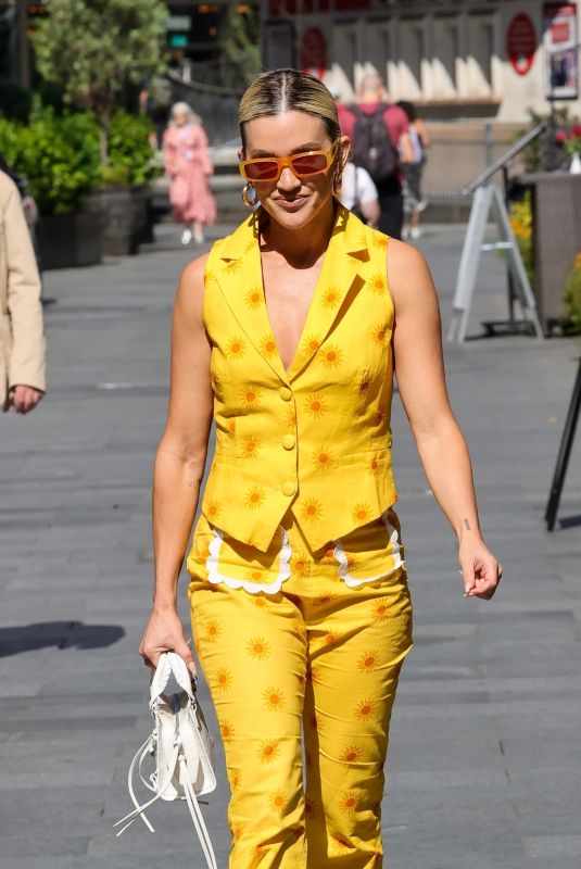 ASHLEY ROBERTS in a Bright Yellow Trousers and Waistcoat Leaves Heart Breakfast Show in London 06/21/2023