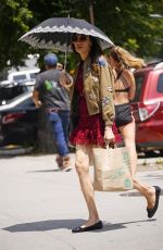 FAMKE JANSSEN Out with Umbrella in New York 05/30/2023