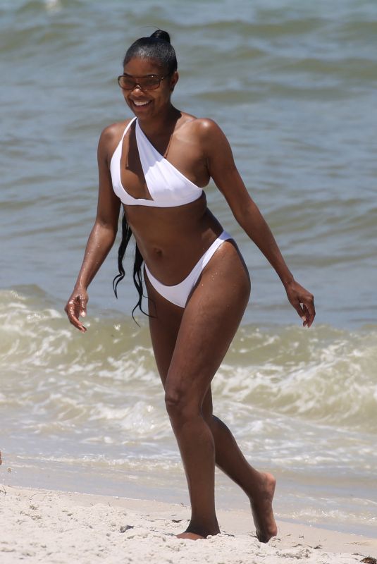 GABRIELLE UNION in a White Bikini at a Beach in Miami 06/15/2023