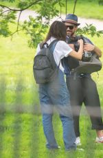 GEMMA CHAN Out with Her Cat Mr Kitty at a Park in London 05/28/2023