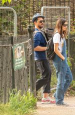 GEMMA CHAN Out with Her Cat Mr Kitty at a Park in London 05/28/2023