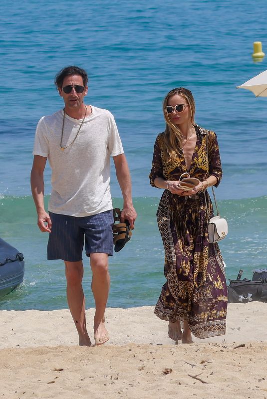 GEORGINA CHAPMAN and Adrien Brody Out at Gigi Beach in Saint-Tropez 05/30/2023