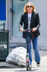 JANE KRAKOWSKI Out on a Scooter in New York 06/20/2023