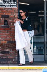 LAURA HARRIER Picking Up Some lLaundry at a Dry Cleaners in Los Feliz 06/03/2023
