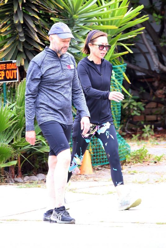LISA JOYNER and Jon Cryer Out Walking in Los Angeles 06/25/2023