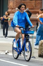 MARGARET QUALLEY Taking a Citi Bike in New York 06/26/2023