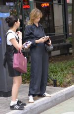 MAYA HAWKE in a Hooded Jumpsuit Out with a Friend in New York 06/15/2023