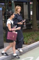 MAYA HAWKE in a Hooded Jumpsuit Out with a Friend in New York 06/15/2023