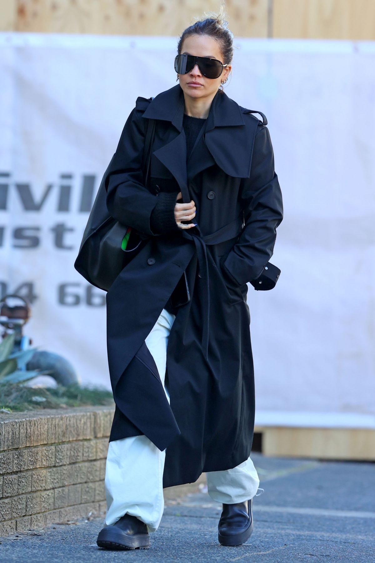RITA ORA in a Black Trench Coat Out in Sydney 06/20/2023 – HawtCelebs