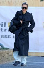 RITA ORA in a Black Trench Coat Out in Sydney 06/20/2023