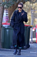 RITA ORA in a Black Trench Coat Out in Sydney 06/20/2023