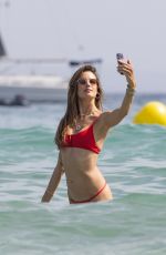 ALESSANDRA AMBROSIO in a Red Bikini at a Beach in Ibiza 07/24/2023
