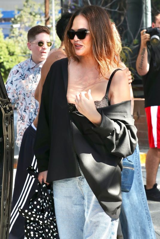 CHRISSY TEIGEN Leaves Beaches Only Club in West Hollywood 07/30/2023