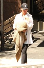 CHRISSY TEIGEN Out and About in West Hollywood 07/10/2023