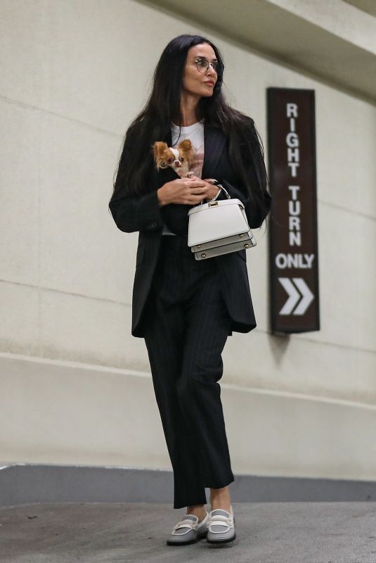 DEMI MOORE Arrives at Honor Titus