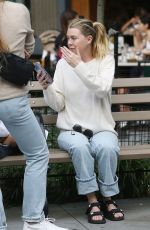 ELLEN POMPEO Waiting on a Park Bench at Bar Pitti in New York 06/30/2023
