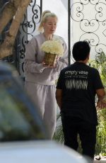 ERIKA JAYNE Receiving Bouquet of Flowers on Her 52nd Birthday in Los Angeles 07/10/2023
