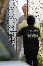ERIKA JAYNE Receiving Bouquet of Flowers on Her 52nd Birthday in Los Angeles 07/10/2023