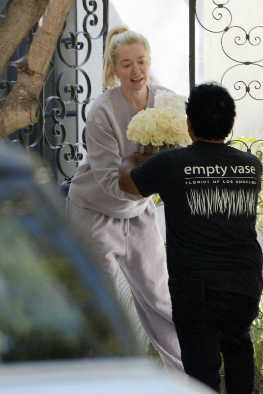 ERIKA JAYNE Receiving Bouquet of Flowers on Her 52nd Birthday in Los Angeles 07/10/2023