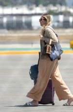 ESTE, DANIELLE and ALANA HAIM at an Airport in Los Angeles 07/07/2023