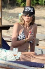 HEIDI KLUM in a Leopard Print Bikini at a Beach in Sardagna 07/11/2023