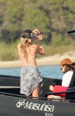 HEIDI KLUM in a Leopard Print Bikini at a Beach in Sardagna 07/11/2023