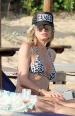 HEIDI KLUM in a Leopard Print Bikini at a Beach in Sardagna 07/11/2023
