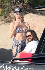 HEIDI KLUM in a Leopard Print Bikini at a Beach in Sardagna 07/11/2023