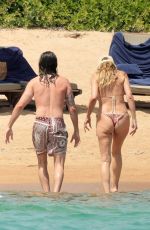 HEIDI KLUM in Bikini at a Beach in Porto Cervo 07/16/2023