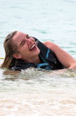 HELEN FLANAGAN on the Beach with Friends in Barbados 07/29/2023