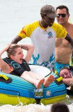 HELEN FLANAGAN on the Beach with Friends in Barbados 07/29/2023