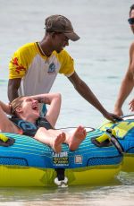 HELEN FLANAGAN on the Beach with Friends in Barbados 07/29/2023