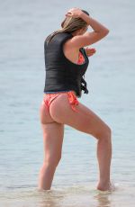 HELEN FLANAGAN on the Beach with Friends in Barbados 07/29/2023