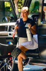 HILARY DUFF in a White Miniskirt Arrives at Sunset Towers in West Hollywood 07/11/2023