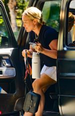 HILARY DUFF in a White Miniskirt Arrives at Sunset Towers in West Hollywood 07/11/2023