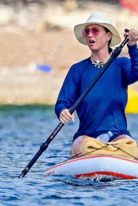 KATY PERRY Paddle Boarding on Vacation in St Tropez 07/18/2023