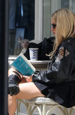 LOTTIE MOSS Out Reading The Unexpected Joy of Being Sober by Catherine Gray in London 07/17/2023